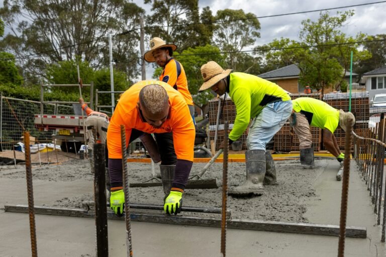 Concrete crew pouring a residential driveway in El Paso